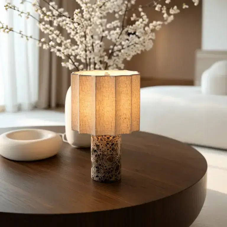 Petra marble and linen table lamp in Kastano marble on a walnut coffee table