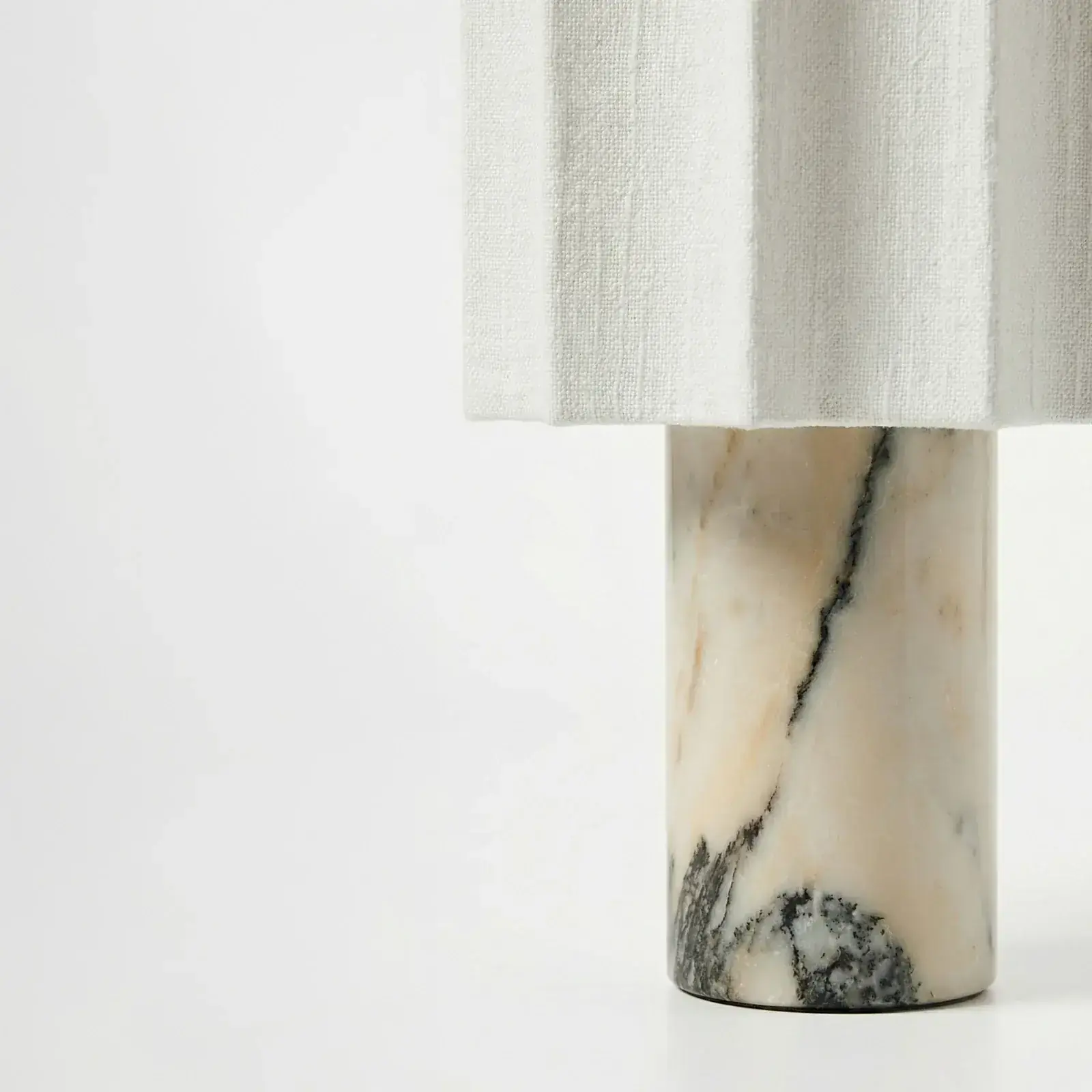 Petra Ivory Coast marble base close-up detail